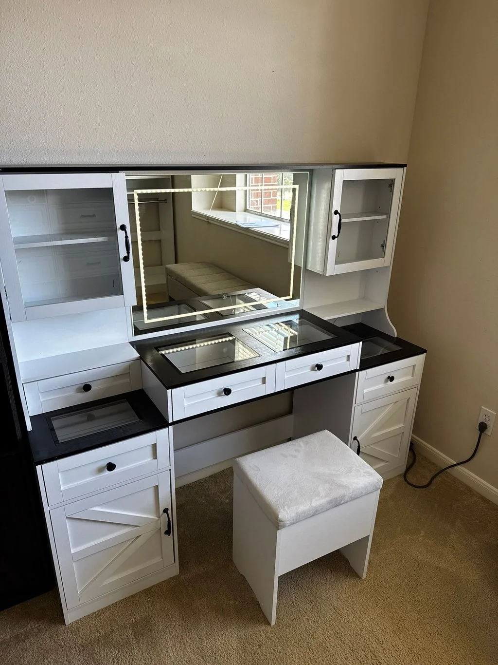 Assembled vanity, mirror, and stool